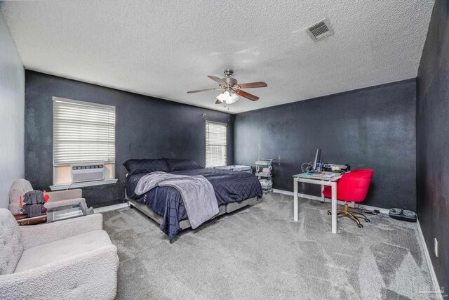 2000 Silverado Rd, Pensacola, FL 32506 - bedroom with baseboards, carpet floors, cooling unit, a ceiling fan, and a textured ceiling