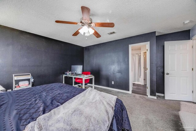 2000 Silverado Rd, Pensacola, FL 32506 - bedroom with carpet floors, baseboards, a ceiling fan, and a textured ceiling