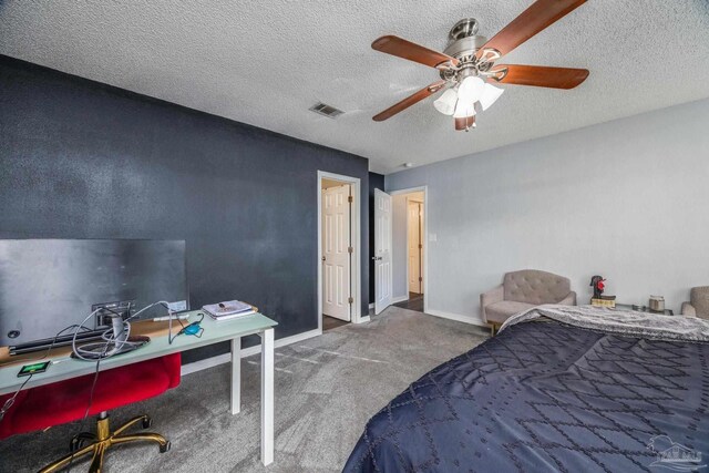 2000 Silverado Rd, Pensacola, FL 32506 - bedroom with carpet, an office area, a textured ceiling, ceiling fan, and baseboards
