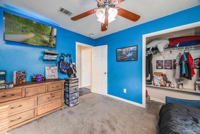 2000 Silverado Rd, Pensacola, FL 32506 - carpeted bedroom featuring a closet, a textured ceiling, ceiling fan, and baseboards