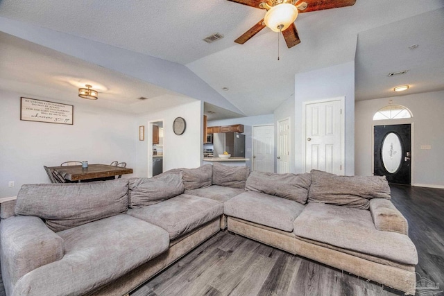 2000 Silverado Rd, Pensacola, FL 32506 - living area with dark wood finished floors, a ceiling fan, vaulted ceiling, and baseboards
