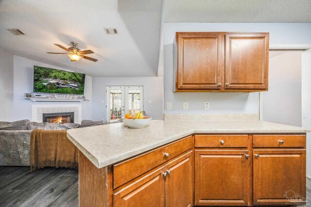 2000 Silverado Rd, Pensacola, FL 32506 - kitchen with a ceiling fan, dark wood-type flooring, open floor plan, light countertops, and lofted ceiling