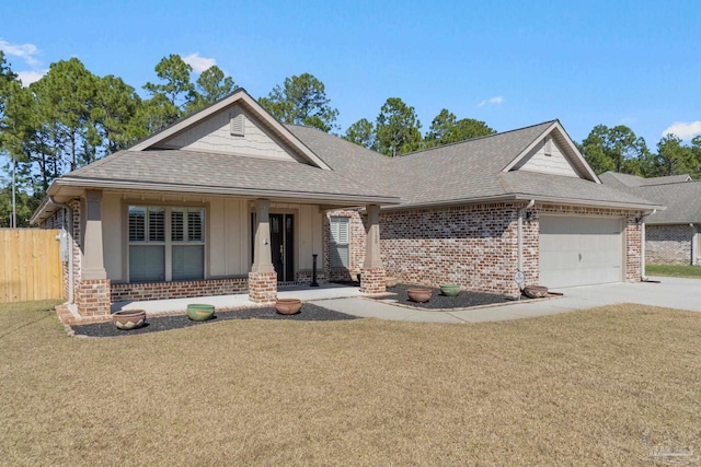 view of front of house featuring brick siding, a shingled roof, concrete driveway, a garage, and a front lawn