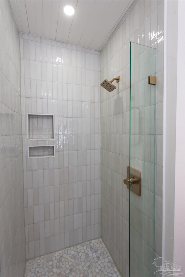 bathroom with a tile shower