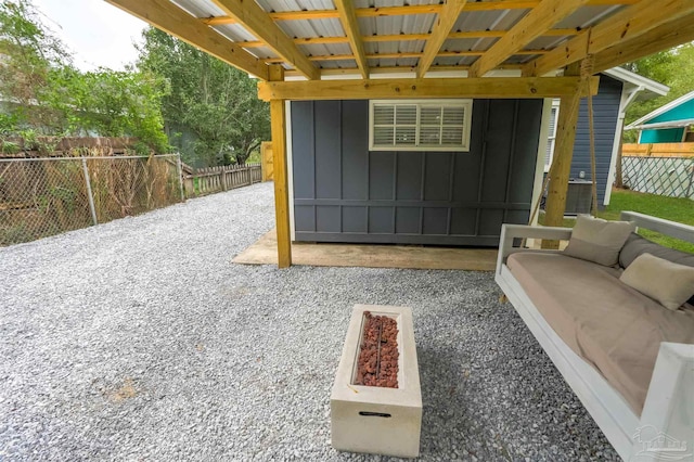 view of patio / terrace with an outdoor fire pit