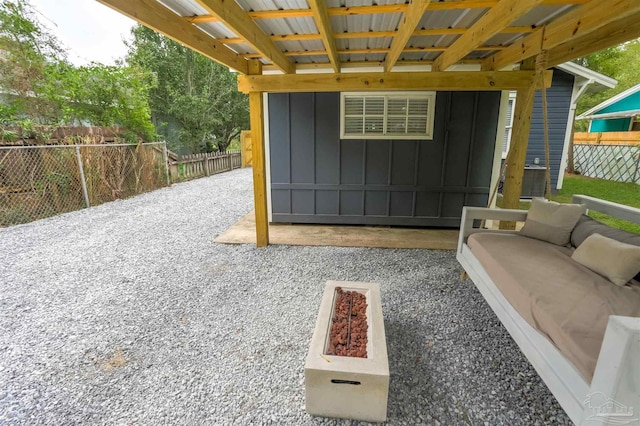 view of patio featuring an outdoor hangout area and fence