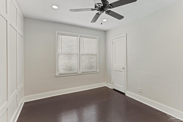 unfurnished bedroom featuring dark wood-type flooring and ceiling fan