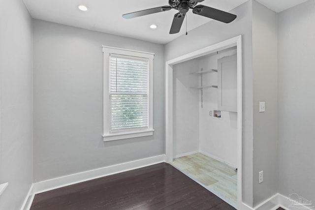 interior space with ceiling fan and dark hardwood / wood-style flooring