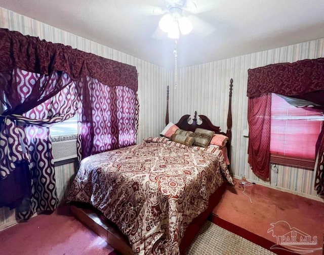 carpeted bedroom featuring ceiling fan and cooling unit