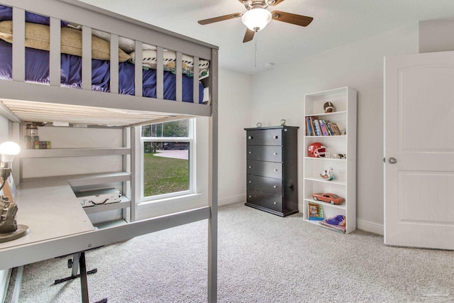 bedroom featuring baseboards, carpet, and a ceiling fan