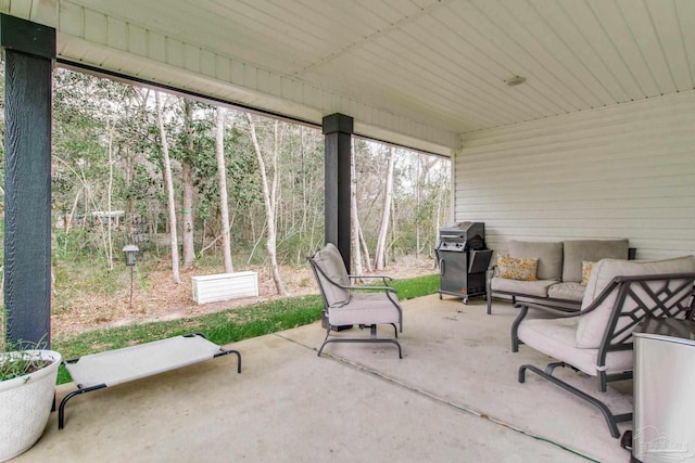 exterior space with an outdoor living space and area for grilling