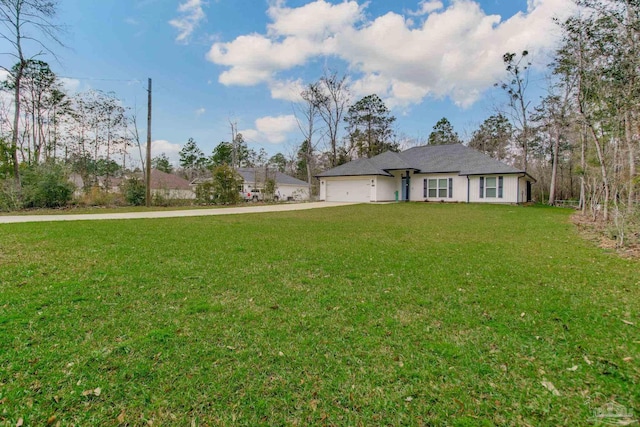 exterior space featuring driveway, a front lawn, and a garage