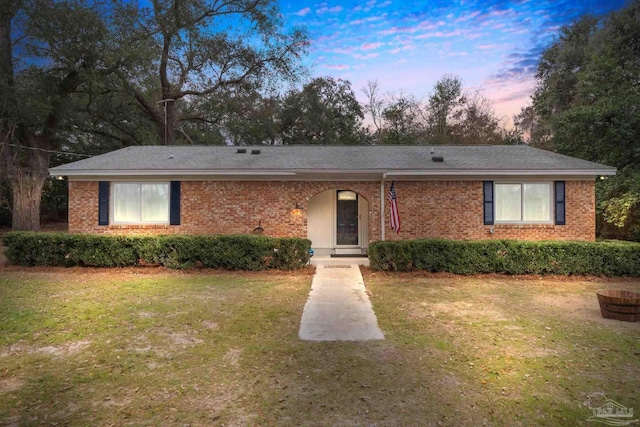 ranch-style house with a yard