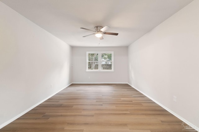 empty room featuring ceiling fan and light hardwood / wood-style flooring