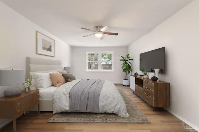 bedroom featuring ceiling fan and light hardwood / wood-style flooring