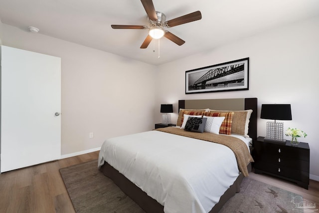 bedroom featuring hardwood / wood-style floors and ceiling fan