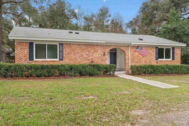 ranch-style house featuring a front lawn