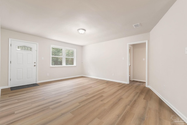 unfurnished room featuring light hardwood / wood-style floors