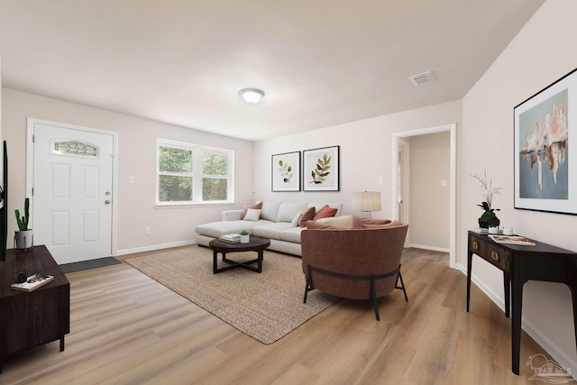 living room with light hardwood / wood-style flooring