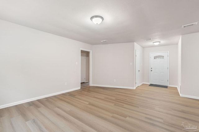 spare room featuring light wood-type flooring