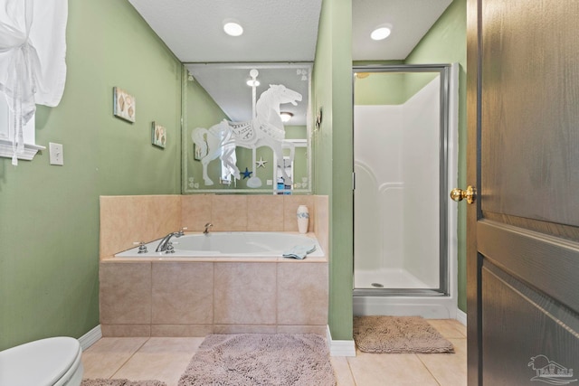 bathroom with tile patterned floors, toilet, a bath, and a shower stall