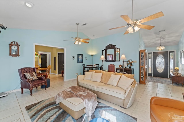 living area featuring light tile patterned floors, visible vents, and lofted ceiling