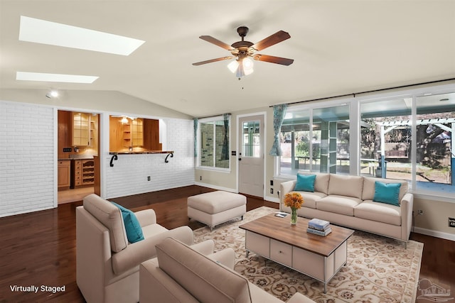 living room with vaulted ceiling with skylight, brick wall, ceiling fan, beverage cooler, and hardwood / wood-style flooring