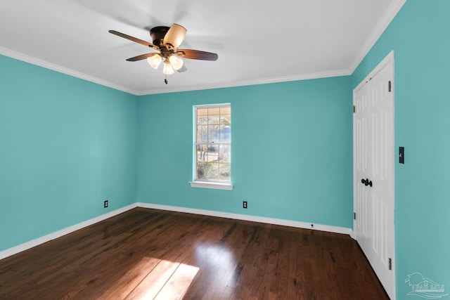 empty room featuring ceiling fan, crown molding, and dark hardwood / wood-style floors