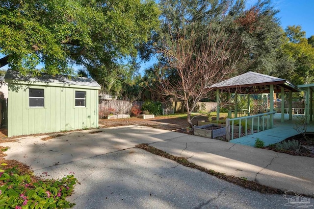 exterior space with a gazebo and a shed