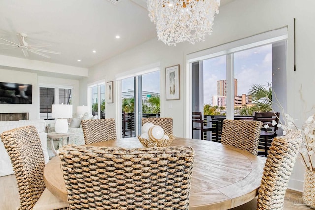 dining room with recessed lighting and ceiling fan with notable chandelier