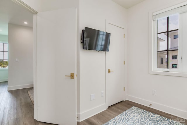 unfurnished bedroom featuring recessed lighting, baseboards, and wood finished floors