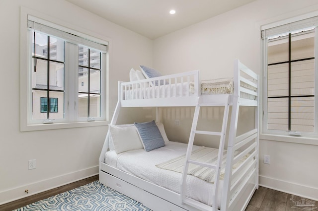 bedroom with dark wood-type flooring, recessed lighting, and baseboards