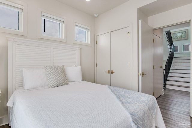 bedroom featuring recessed lighting, a closet, and wood finished floors