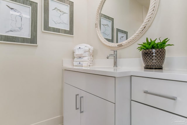 bathroom featuring vanity and baseboards