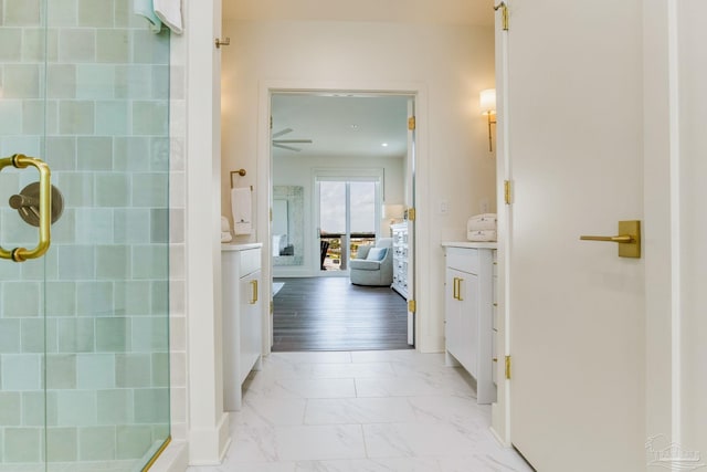 full bath with marble finish floor, ensuite bath, and a shower stall