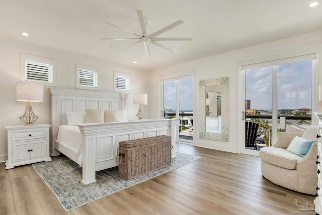 bedroom featuring access to outside, recessed lighting, and light wood-style flooring