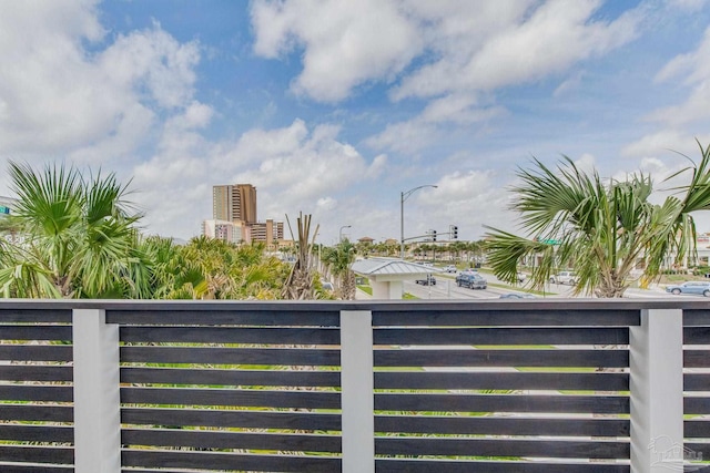 view of gate with a city view