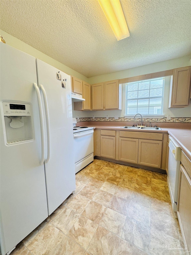 3081 Flintlock Dr, Pensacola, FL 32526 - kitchen featuring white appliances, under cabinet range hood, a sink, light brown cabinets, and a textured ceiling