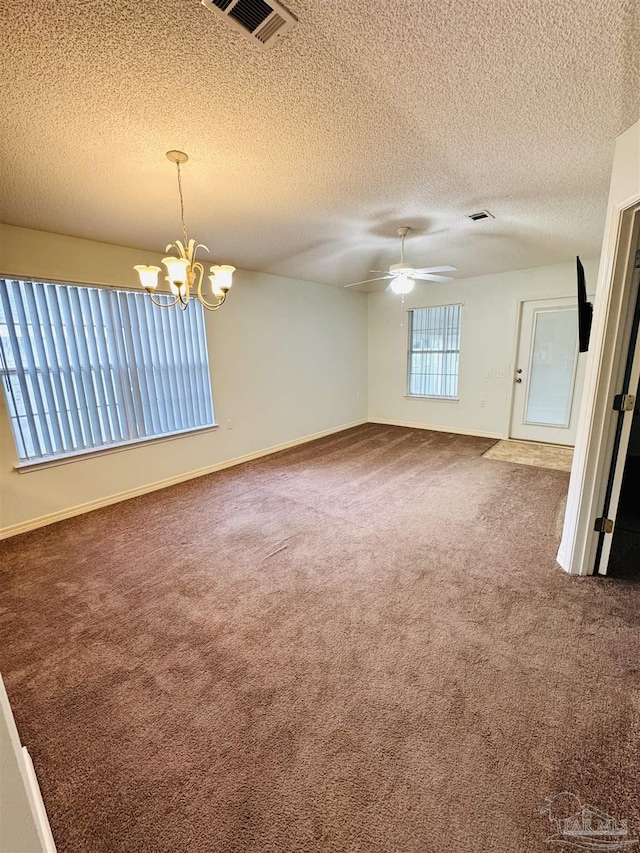 3081 Flintlock Dr, Pensacola, FL 32526 - empty room featuring carpet, a chandelier, a textured ceiling, ceiling fan, and baseboards