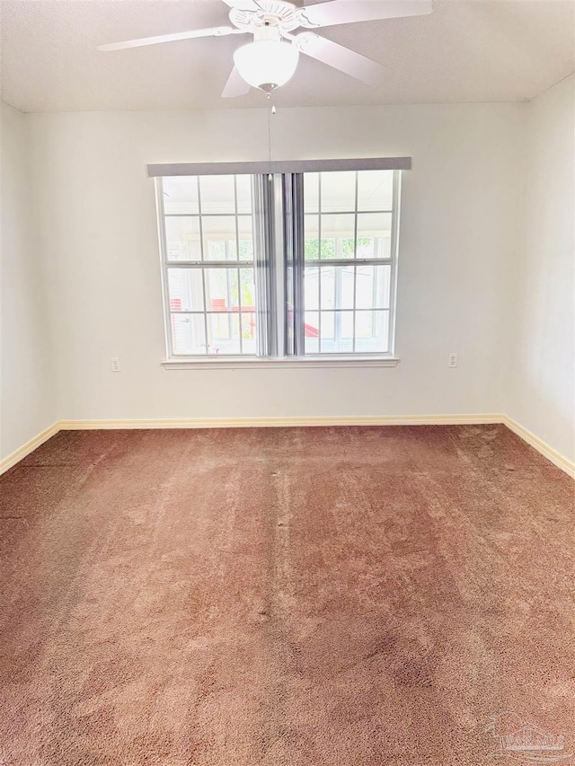 3081 Flintlock Dr, Pensacola, FL 32526 - unfurnished room featuring carpet floors, baseboards, and a ceiling fan