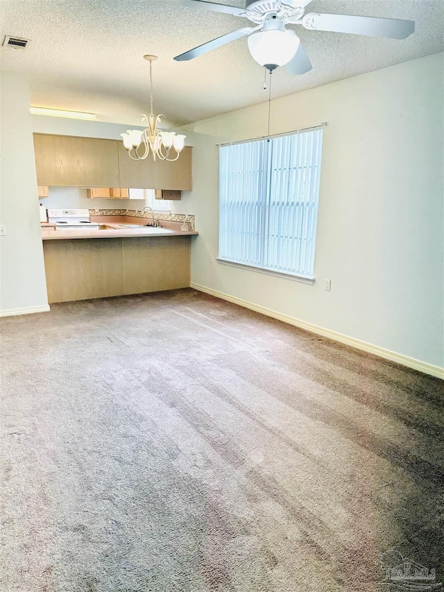 3081 Flintlock Dr, Pensacola, FL 32526 - kitchen with a chandelier, ceiling fan, electric range, a textured ceiling, and baseboards