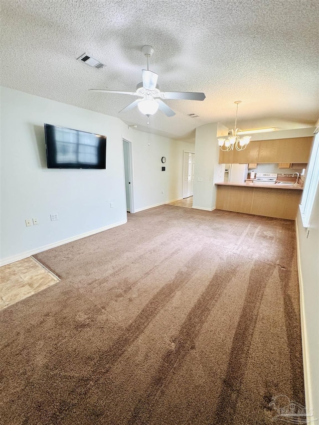 3081 Flintlock Dr, Pensacola, FL 32526 - unfurnished living room with light colored carpet, a ceiling fan, a chandelier, baseboards, and a textured ceiling