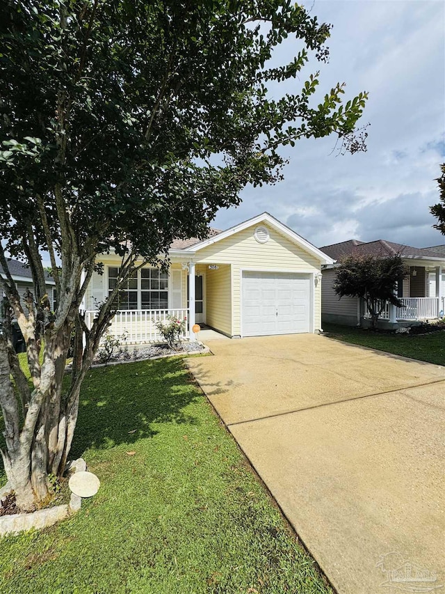3081 Flintlock Dr, Pensacola, FL 32526 - view of front facade featuring a porch, an attached garage, driveway, and a front yard