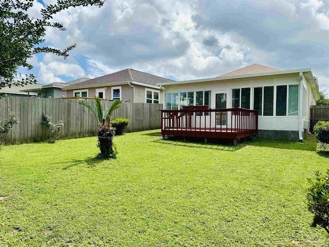 3081 Flintlock Dr, Pensacola, FL 32526 - rear view of house featuring a deck and a sunroom