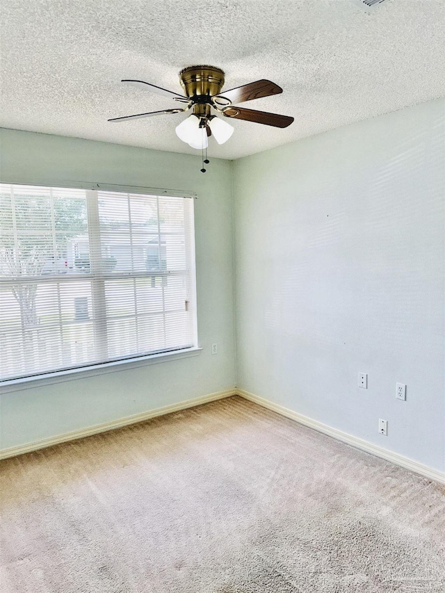 3081 Flintlock Dr, Pensacola, FL 32526 - unfurnished room with carpet flooring, a ceiling fan, baseboards, and a textured ceiling