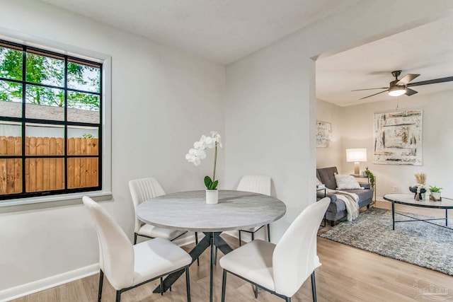 dining room featuring light wood-type flooring and ceiling fan