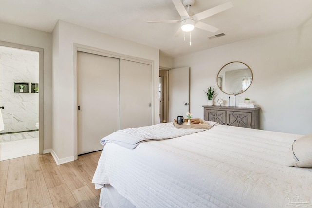 bedroom featuring a closet, ceiling fan, and light wood-type flooring