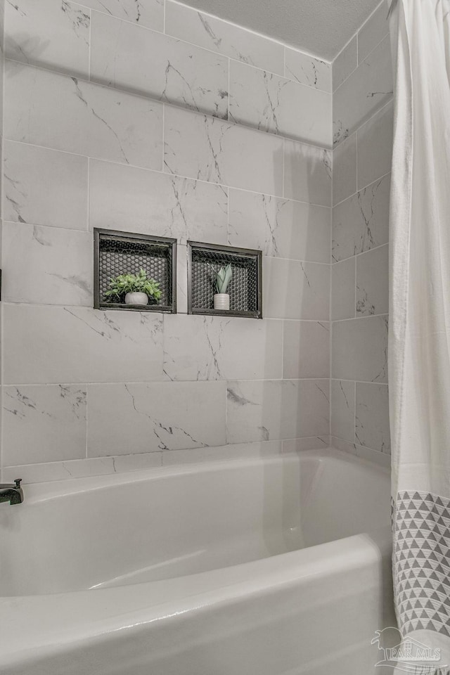 bathroom featuring shower / bath combo