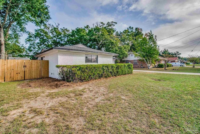 view of property exterior featuring a yard