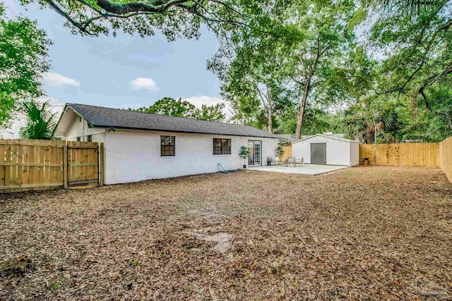 back of house with a patio